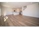 Open concept kitchen and living area with modern appliances and wood-look floors at 168 Velvet Hat Rd, Danville, IN 46122