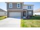 Two-story brick home with a gray accent and attached two-car garage at 168 Velvet Hat Rd, Danville, IN 46122