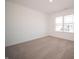 Bright bedroom with a large window and neutral carpeting at 168 Velvet Hat Rd, Danville, IN 46122