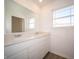 Bathroom boasts a double vanity and large mirror at 168 Velvet Hat Rd, Danville, IN 46122