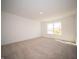 Large bedroom with neutral wall and carpet, plus a window at 168 Velvet Hat Rd, Danville, IN 46122