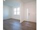 Bright and airy living room with hardwood floors and large windows at 168 Velvet Hat Rd, Danville, IN 46122