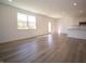 Open concept kitchen and living area with modern appliances and wood-look floors at 168 Velvet Hat Rd, Danville, IN 46122