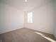 Bright bedroom featuring neutral carpeting and large window at 168 Velvet Hat Rd, Danville, IN 46122