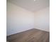 Simple bedroom with hardwood floors and neutral-colored walls at 168 Velvet Hat Rd, Danville, IN 46122