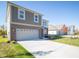 Two-story brick home with gray accents and attached two-car garage at 168 Velvet Hat Rd, Danville, IN 46122