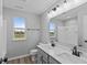 Modern bathroom with double vanity, gray cabinets, and a shower/tub combo at 4959 Amber Crest Dr, Brownsburg, IN 46112