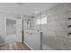 Spa-like bathroom with a large walk-in shower and marble tile at 4959 Amber Crest Dr, Brownsburg, IN 46112