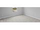 Well-lit bedroom with gray walls and new carpeting at 4959 Amber Crest Dr, Brownsburg, IN 46112