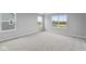Bright bedroom featuring ample natural light and neutral carpeting at 4959 Amber Crest Dr, Brownsburg, IN 46112