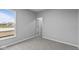 Well-lit bedroom with a view and neutral colored carpet at 4959 Amber Crest Dr, Brownsburg, IN 46112