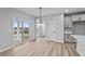 Bright dining area with hardwood floors and sliding doors to the patio at 4959 Amber Crest Dr, Brownsburg, IN 46112