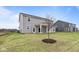 Gray two-story house with covered patio and grassy backyard at 4959 Amber Crest Dr, Brownsburg, IN 46112