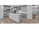 Modern kitchen with gray cabinets, island, and access to the dining area at 4959 Amber Crest Dr, Brownsburg, IN 46112