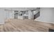 Open floor plan featuring a kitchen with an island and a dining area with vinyl plank flooring at 4959 Amber Crest Dr, Brownsburg, IN 46112
