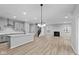 Spacious living room with hardwood floors, fireplace, and open to kitchen at 4959 Amber Crest Dr, Brownsburg, IN 46112