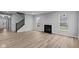 Spacious living room featuring a fireplace and vinyl plank flooring at 4959 Amber Crest Dr, Brownsburg, IN 46112