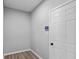 Empty storage room with wood flooring and white door at 4959 Amber Crest Dr, Brownsburg, IN 46112