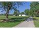 Ranch home with gravel driveway and expansive yard at 941 N 500 W, Columbus, IN 47201