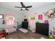 bedroom with twin bed, pink decor, and plenty of storage at 941 N 500 W, Columbus, IN 47201
