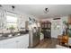 Galley kitchen with white cabinets and stainless steel refrigerator at 941 N 500 W, Columbus, IN 47201