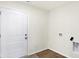 Laundry room with a white door, vinyl flooring, and hookups for washer/dryer at 134 Maxim Ct, Cumberland, IN 46229