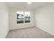 Bright bedroom with neutral walls and carpet, featuring a large window at 134 Maxim Ct, Cumberland, IN 46229