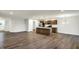 Open concept kitchen with island, stainless steel appliances, and wood cabinets at 134 Maxim Ct, Cumberland, IN 46229