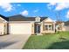 Two-car garage and ranch style home at 134 Maxim Ct, Cumberland, IN 46229