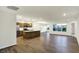 Open concept kitchen with island, stainless steel appliances, and wood cabinets at 134 Maxim Ct, Cumberland, IN 46229