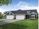 Two-car garage, stone accents, and a charming front entrance at 134 Maxim Ct, Cumberland, IN 46229