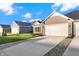 Exterior view of charming ranch home with attached garage and landscaped lawn at 134 Maxim Ct, Cumberland, IN 46229