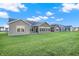 Community backyard with multiple homes and lush green grass at 134 Maxim Ct, Cumberland, IN 46229