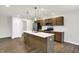 Modern kitchen with island, stainless steel appliances, and wood cabinets at 134 Maxim Ct, Cumberland, IN 46229