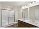 Bathroom with double vanity, large mirror and shower at 134 Maxim Ct, Cumberland, IN 46229