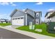 Two-car garage with white door and blue exterior at 9287 Loyola Way, Plainfield, IN 46168