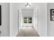 Hallway with carpet, window, and doors to bedrooms at 6275 Canak Dr, Avon, IN 46123