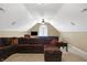 Bonus room features a sectional sofa and large TV perfect for relaxing at 6275 Canak Dr, Avon, IN 46123