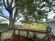View from deck showcasing backyard, large tree, and shed at 108 N Summit St, Summitville, IN 46070