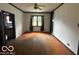 Empty dining room with hardwood floors and ceiling fan at 108 N Summit St, Summitville, IN 46070