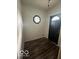Bright entryway with dark door and geometric window at 108 N Summit St, Summitville, IN 46070