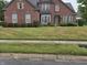 Two-story brick home with a spacious front yard at 10870 Picket Fence Pl, Fishers, IN 46037