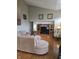Spacious living room with hardwood floors and built-in entertainment center at 10870 Picket Fence Pl, Fishers, IN 46037