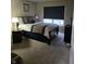 Comfortable bedroom with a queen-size bed and window coverings at 10870 Picket Fence Pl, Fishers, IN 46037