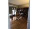 Home office with built-in shelving and hardwood floors at 10870 Picket Fence Pl, Fishers, IN 46037