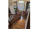 Bright and spacious entryway with hardwood floors and staircase at 10870 Picket Fence Pl, Fishers, IN 46037