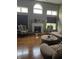 Living room features hardwood floors, fireplace and large windows at 10870 Picket Fence Pl, Fishers, IN 46037