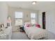 Charming bedroom with a twin bed and plenty of natural light at 3923 Windstar Way, Columbus, IN 47203