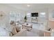 Relaxing living room featuring neutral decor and ample natural light at 3923 Windstar Way, Columbus, IN 47203