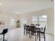 Bright dining area with a table and chairs near sliding glass doors at 3923 Windstar Way, Columbus, IN 47203